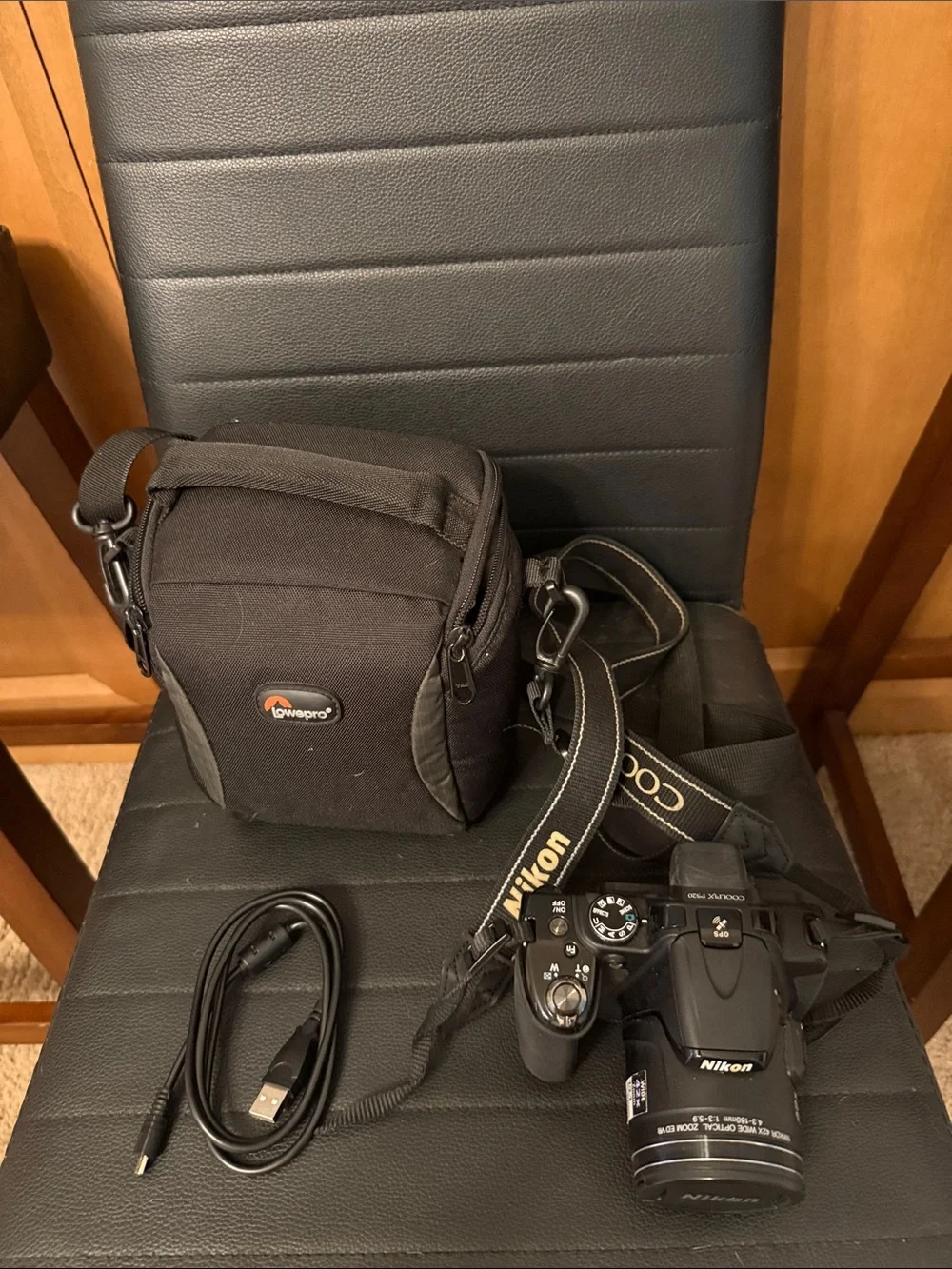 Nikon Black DSLR Camera with Black Lowepro Case and USB Cable
